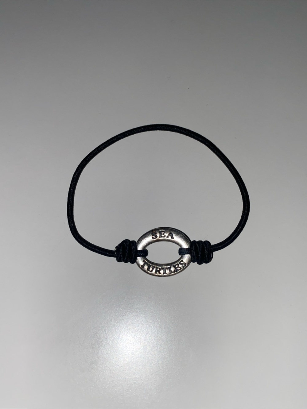 I Care About Sea Turtles Silver Ring Bracelet on Black Cord